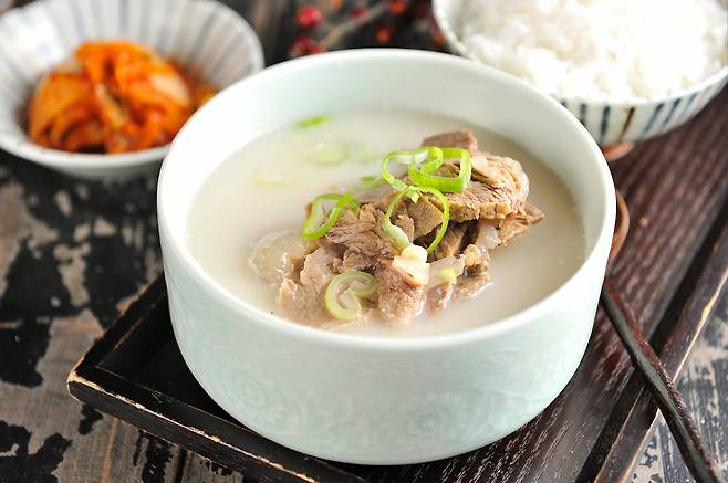 Gomtang, or slow-simmered beef bone soup, served with spicy radish kimchi [GETTY IMAGES BANK]