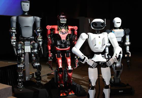 Humanoid robots from Korean startups AeiROBOT, Rainbow Robotics, Robros and Blue Robin stand at a ceremony marking the launch of the "K-Humanoid Alliance" in central Seoul on April 10. [YONHAP]