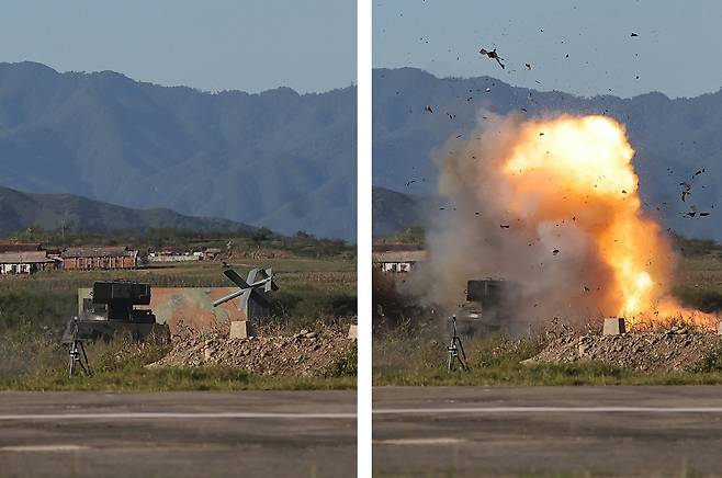 An AI-guided suicide drone strikes a target during a test on Sept. 18 in this picture provided by the North Korean state media Korean Central News Agency (KCNA) published a day after. Pyongyang for the first time revealed such drone strikes without pixelation, suggesting the drone can autonomously identify and attack enemy equipment. [NEWS1]