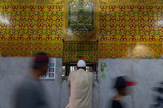 A Muslim man offers prayers at Mahim Dargah, a Muslim shrine in Mumbai on April 2. [AP/RAFIQ MAQBOOL]