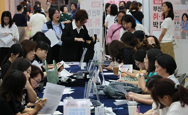 Visitors are seen at a job fair for women hosted by the Busan city government and the Busan Women's Culture Center, where special programs for women who have had to leave the workforce due to marriage or parenting were provided, at Busan City Hall on Sept. 30, 2024. [SONG BONG-GEUN]
