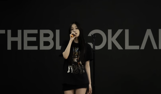 Allday Project's Annie is seen practicing rapping during her time as a trainee at The Black Label, as seen on Allday Project's short documentary "Day 1." (Allday Project/YouTube)