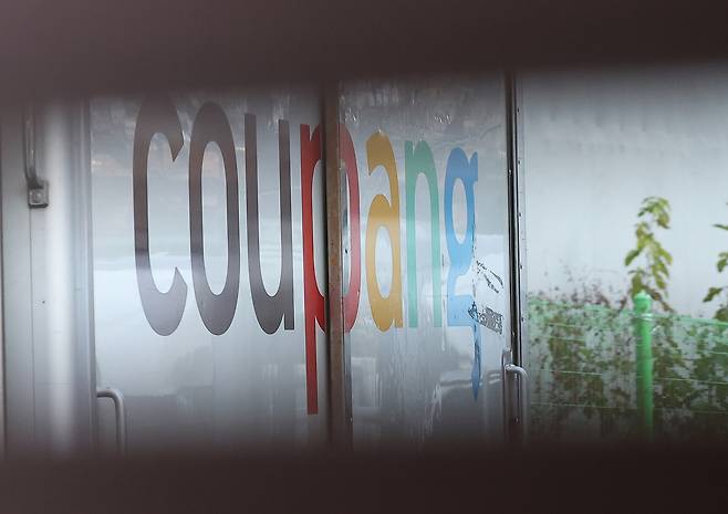 The Coupang company logo is seen on a delivery truck at a logistics center in Seoul on Dec. 1. [YONHAP]