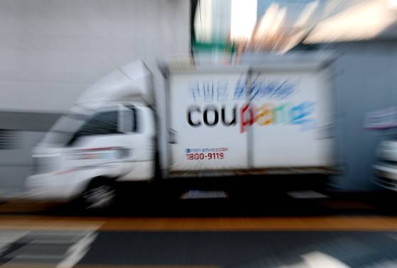 A Coupang delivery truck is parked at the company's logistics center in Seoul on Dec. 7. [NEWS1]