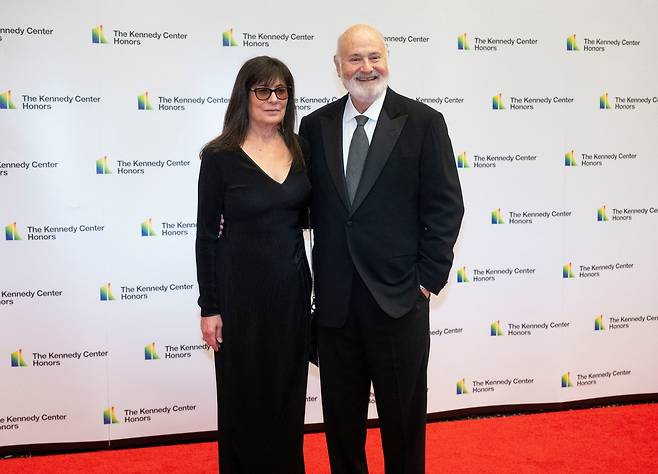 ADDITION ADDS MAIDEN NAME: FILE - Rob Reiner and Michele Singer Reiner arrive on the red carpet at the State Department for the Kennedy Center Honors gala dinner, Dec. 2, 2023, in Washington. (AP Photo/Kevin Wolf, File)