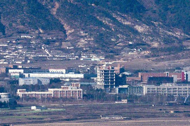 The Kaesong Industrial Complex is seen from a border area in Paju, Gyeonggi Province, with about half of the general support center building remaining after demolition work by North Korea. The photo was taken on Nov. 18. (Yonhap)