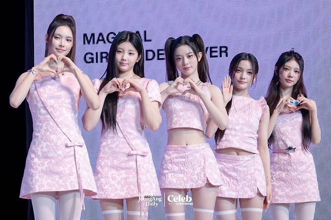 Girl group ILLIT poses for photos during a showcase for the release of its 3rd EP, “bomb,” at the Yes24 Live Hall in eastern Seoul on June 16. [DANIELA GONZALEZ PEREZ]