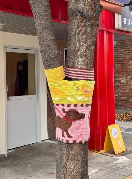 Joo’s knit piece features animals she frequently encounters in Seochon, such as dogs and cats. (Courtesy of Joo)