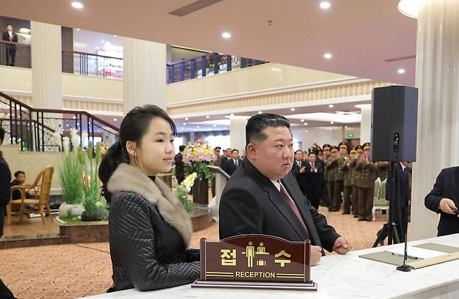 North Korean leader Kim Jong-un, right, attends the completion ceremony of a hotel at the Samjiyon tourist zone near Mount Paektu, accompanied by his daughter Kim Ju-ae, on Dec. 23. [RODONG SINMUN]
