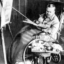 휠체어에 앉아 그림을 그리는 보리스의 사진.