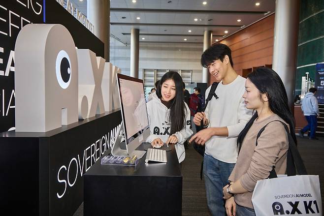 SK Telecom’s exhibition booth is on display at COEX during the first presentation of the sovereign AI foundation model project, hosted by the Ministry of Science and ICT on Tuesday. (SK Telecom)