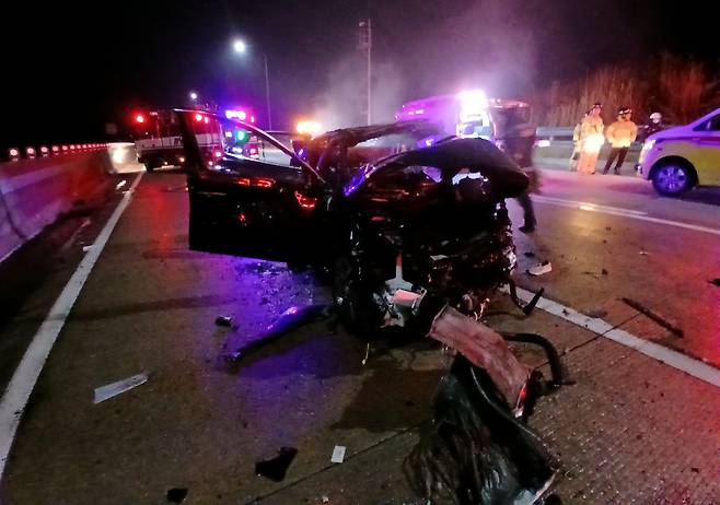 A vehicle is seen heavily damaged after a series of traffic accidents on the westbound Seohaean Expressway near the Gochang interchange in Gochang, North Jeolla Province, Sunday. (North Jeolla Provincial Fire Service)