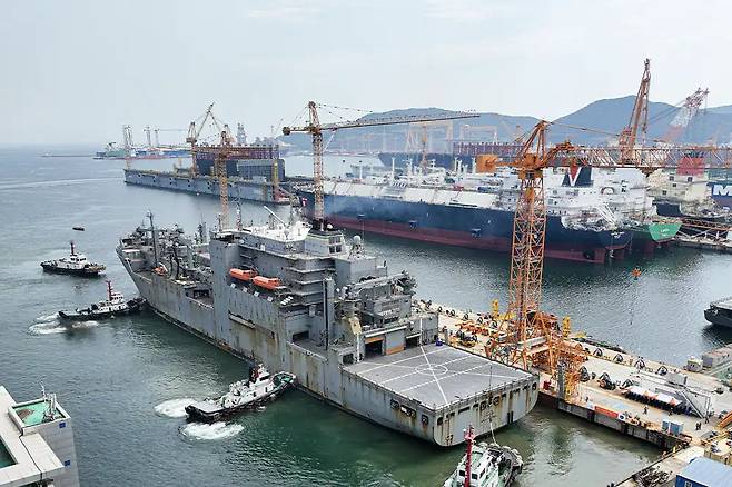 The USNS Wally Schirra, a US Navy dry cargo and ammunition ship, is docked at Hanwha Ocean’s Geoje shipyard for maintenance and inspection in South Gyeongsang Province. (Hanwha Ocean)