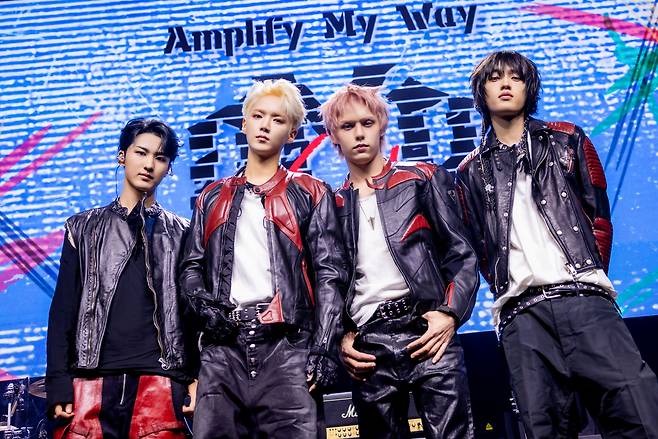 AxMxP poses for a group photo during a media showcase held ahead of the release of "Amplify My Way," at Yes24 Wanderloch Hall in Seodaemun-gu, western Seoul, Wednesday. (FNC Entertainment)