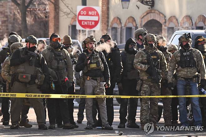 24일(현지시간) 미국 미네소타주 미니애폴리스에 배치된 연방 요원들 [AFP 연합뉴스]