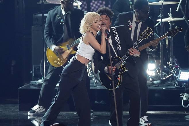 Rose, left, and Bruno Mars perfom “APT.” during the 68th annual Grammy Awards on Sunday, Feb. 1, 2026, in Los Angeles. (AP Photo/Chris Pizzello)