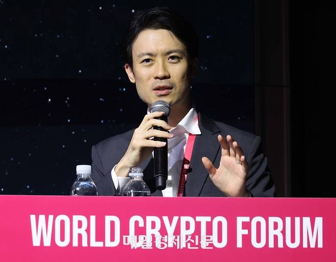 월드크립토포럼(WCF)에서 발표 중인 타케자와 유스케(Takezawa Yusuke) 프로그마(Progmat) 글로벌 사업개발 부문 부사장. [한주형 기자]