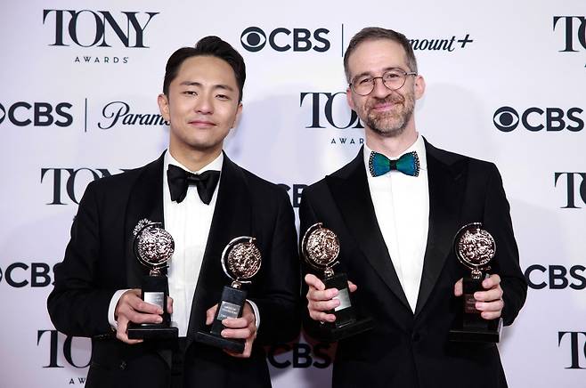 South Korean lyricist and music writer Hue Park (L) and US orchestrator Will Aronson pose with the Best Score award for “Maybe Happy Ending” in the pressroom during the 78th Tony Awards at Radio City Music Hall in New York on June 8, 2025. (Photo by kena betancur / AFP)
