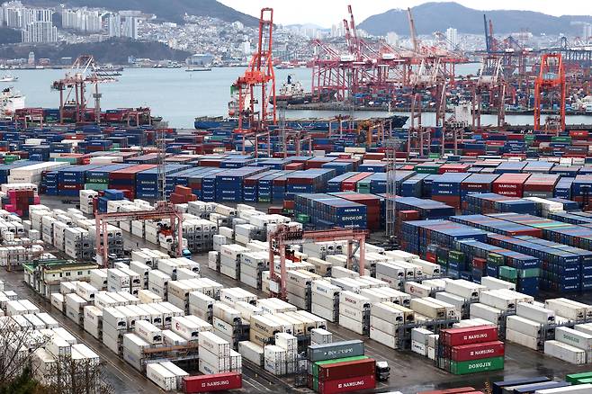 Containers are stacked at the Port of Busan in Busan on March 6. [YONHAP]