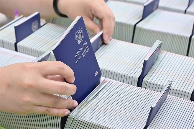 A worker organizes newly issued passports at the Suwon City Passport Office in Suwon, Gyeonggi, on July 2, 2025. [JOINT PRESS CORPS]