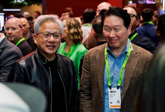 Nvidia CEO Jensen Huang and SK Group Chairman Chey Tae-won attend the Nvidia GTC global AI conference in San Jose, California, on March 16. [REUTERS/YONHAP[