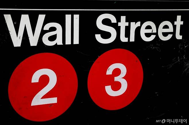 A sign for the Wall Street subway station in the financial district in New York City, U.S., August 23, 2018. REUTERS/Brendan McDermid/File Photo