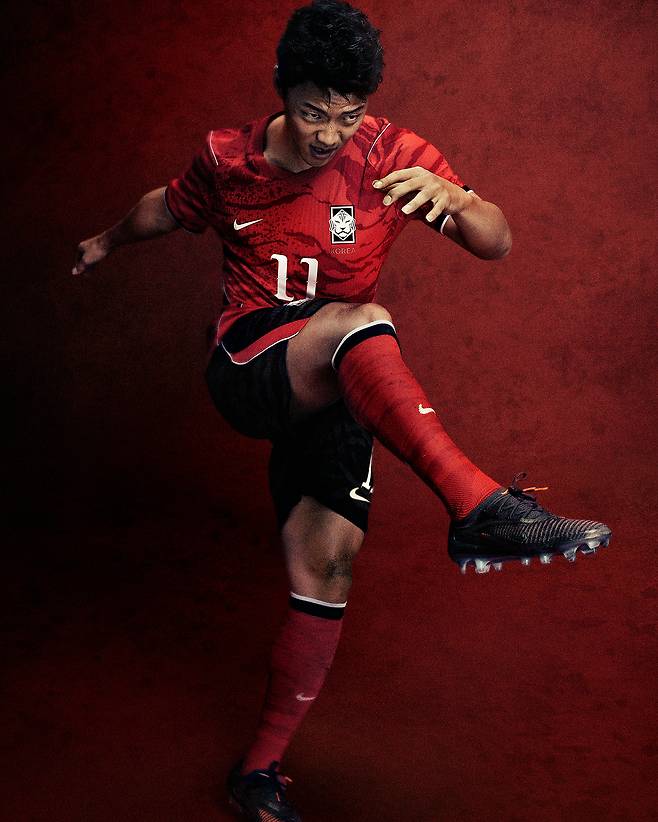 National football team player Hwang Hee-chan models the new red-and-black uniform designed by Nike [NIKE]