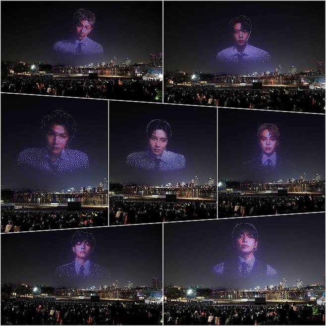 방탄소년단(BTS)의 완전체 컴백 공연을 하루 앞둔 20일 밤 서울 뚝섬한강공원에서 관련 드론쇼가 펼쳐지고 있다. 연합뉴스