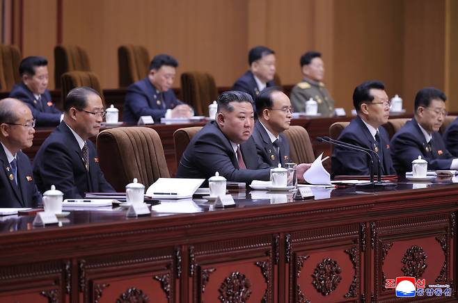 North Korean leader Kim Jong-un, center, presides over the first-day session of the 15th Supreme People’s Assembly in Pyongyang on March 22, where he was reappointed as chairman of the state affairs commission, in this photo carried by the Korean Central News Agency on March 23. [YONHAP]