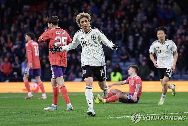 결승골을 터트리고 기뻐하는 일본의 이토 준야 [로이터=연합뉴스]