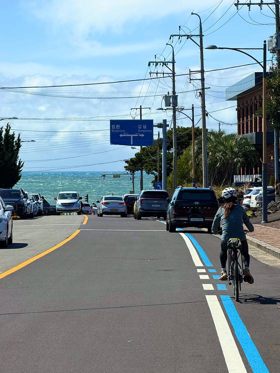Riding toward the sea on the outskirts of Seogwipo on April 4. [JIM BULLEY]