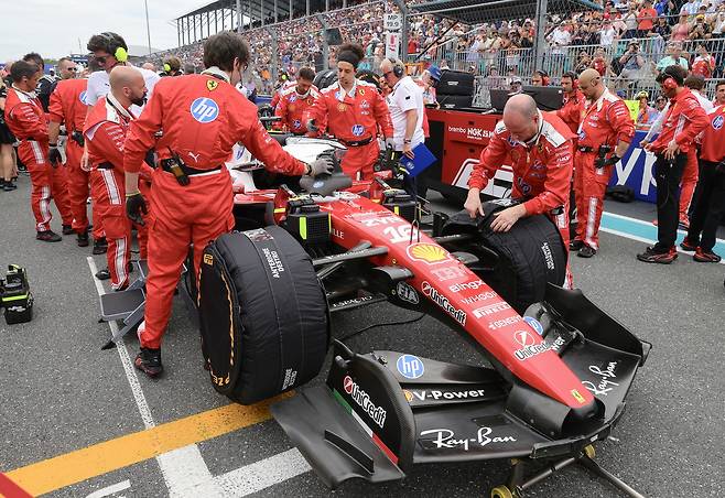 The car of Scuderia Ferrari driver Charles Leclerc of Monaco is pushed into the starting grid prior to the Formula 1 Miami Grand Prix at the Miami International Autodrome in Miami Gardens, Florida, May 3. (EPA)
