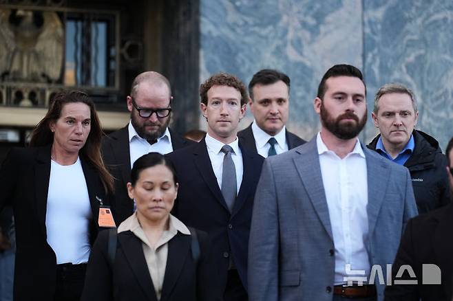 Meta CEO Mark Zuckerberg leaves after testifying in a landmark trial over whether social media platforms deliberately addict and harm children, Wednesday, Feb. 18, 2026, in Los Angeles. (AP Photo/Damian Dovarganes)