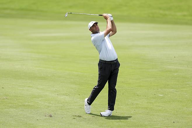 MCKINNEY, TEXAS - MAY 22: Scottie Scheffler of the United States hits an approach shot on the sixth hole during the second round of THE CJ CUP Byron Nelson 2026 at TPC Craig Ranch on May 22, 2026 in McKinney, Texas. (Photo by Mike Mulholland/Getty Images for The CJ Cup)