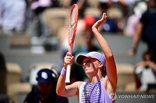 이가 시비옹테크의 1회전 경기 모습 [AFP=연합뉴스]