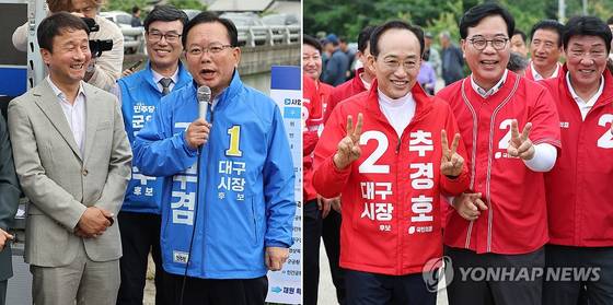 더불어민주당 김부겸 대구시장 후보(왼쪽)와 국민의힘 추경호 대구시장 후보가 28일 대구 군위군 대구경북신공항 부지를 찾아 주민들과 만나고 있다. 〈사진=연합뉴스〉