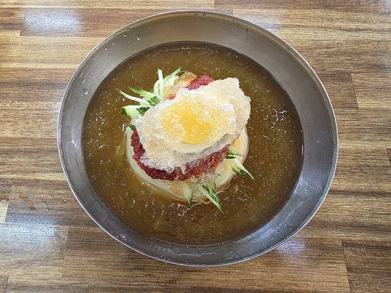 A bowl of milmyeon (cold wheat noodles) at Dongrae Milmyeon, known to have been visited by BTS's RM [JIN EUN-SOO]