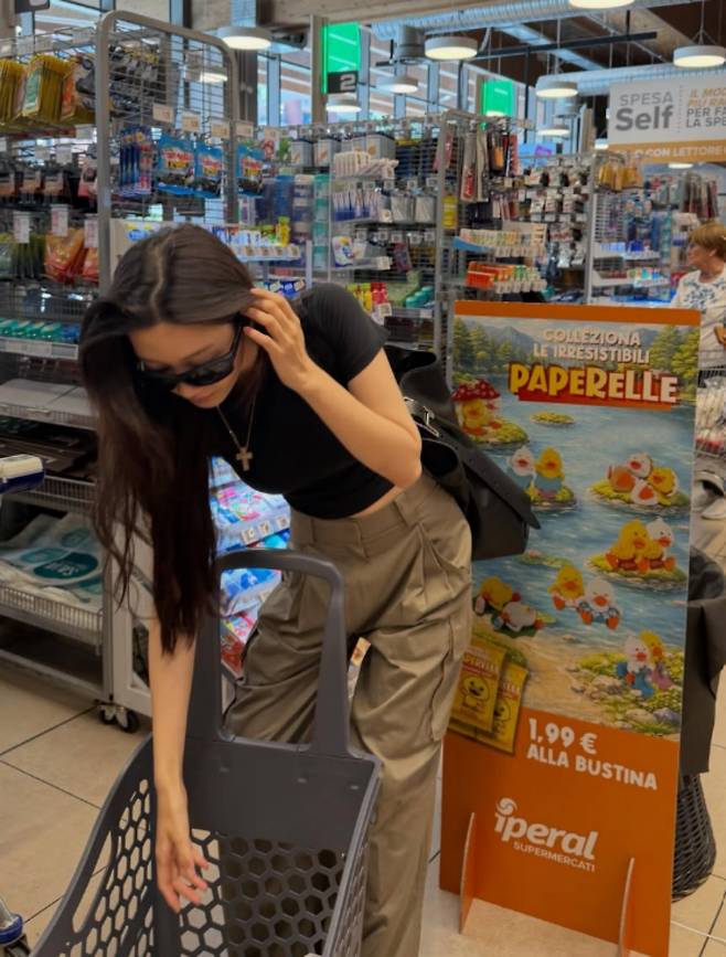Actress Moon Ga-young shared an update on her personal social media account, showing herself shopping at a local supermarket in Europe. In the released photos, Moon Ga-young caught attention by revealing her slim figure in a comfortable outfit consisting of a black crop top and wide-leg pants.Moon Ga-young showcased a natural style by wearing sunglasses, boasting striking visuals even in her simple appearance. She garnered interest from fans by exuding a stylish vibe even in her ordinary daily life.Meanwhile, Moon Ga-young recently won the Best Actress Award in the film category at the 62nd Baeksang Arts Awards for her role in the movie *If We*. For her next project, she has confirmed her appearance in the new tvN drama *Whale Star* and is set to take on the challenge of acting in a period drama.
