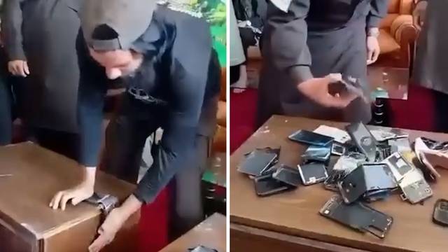 스마트폰 파괴하는 탈레반 당국. 영국 일간 가디언 캡처·연합뉴스