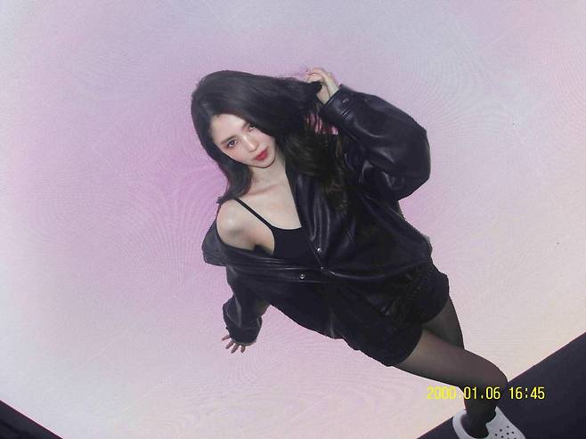 Actress Han So Hee showcased her unrivaled alluring beauty on her social media, perfectly pulling off an all-black outfit. At a clothing advertisement shoot, Han So Hee added a striking pop of color with bold red lipstick to a sophisticated look featuring a black leather jacket, shorts, and stockings.In the released photos, Han So Hee captivated viewers with her stunning legs and flawless skin set against a backdrop of the citys nightscape. Her natural pose while sitting on a chair and her atmospheric appearance drew admiration from fans.Meanwhile, Han So Hee is set to appear in the upcoming film *Intern* and has confirmed her participation in the Netflix original series *Solo Leveling*.