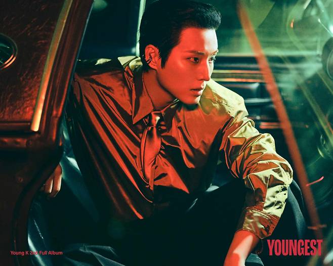 DAY6s Young K has unveiled concept photos for his upcoming second full-length album, YOUNGEST, set to be released on the 27th, showcasing his diverse charms. This album marks Young Ks first solo release in approximately two years and ten months, and he has demonstrated his musical prowess by personally working on all 15 tracks, including the title track Shut The Door.In the released teaser images, Young K heightened anticipation for the new album by creating contrasting moods where a warm and gentle atmosphere coexists with an intense and chilling tension. His agency, JYP Entertainment, plans to sequentially release Key of the YOUNGEST teaser content via official social media starting on the 17th.In addition to the title track Shut The Door, this second full-length album includes 15 tracks that deeply reflect Young Ks unique musical style, such as Marionette, Cheering Song, and 100 Reasons Why We Will Break Up. The new album will be officially released on July 27 at 6 p.m.Young K will continue his active promotions following his comeback. From August 14 to 16, he plans to meet fans by holding his solo tour, Young K Solo Tour YOUNGEST in INCHEON, at the Incheon Inspire Arena.