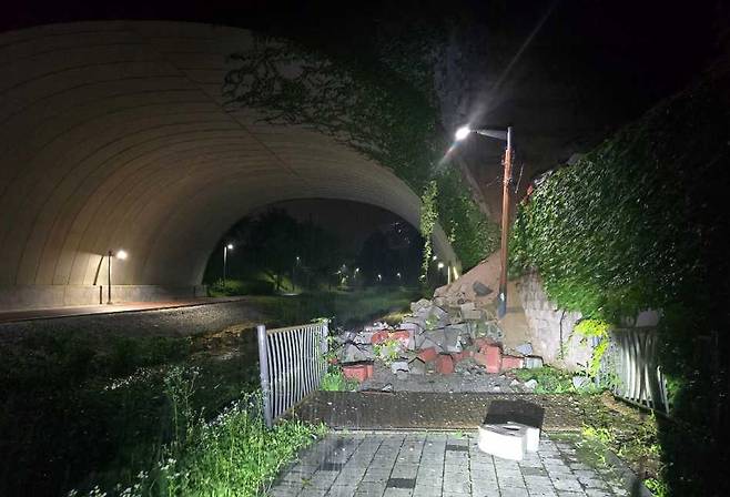 A brick wall beside an underpass collapsed after heavy rain fell in Wonju, Gangwon, on July 19. WONJU FIRE STATION