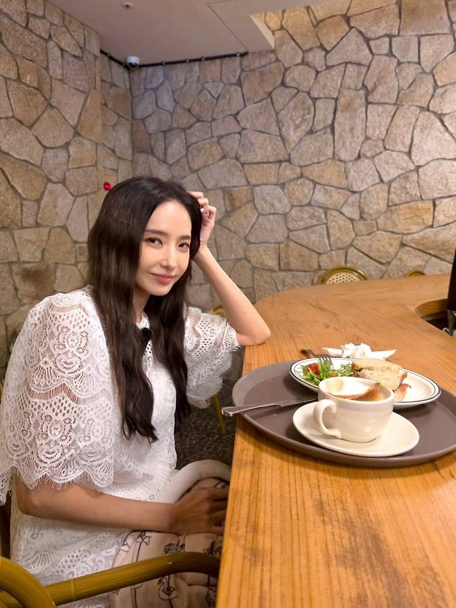 Actor Han Chae-young showed off her unchanging beauty through her social media account, revealing recent photos reminiscent of her prime. In a photo where she is holding an apple, Han Chae-young captivated attention by highlighting her small face size.In the released photos, Han Chae-young perfectly pulled off a glamorous short dress featuring prominent lace details. Along with scenes of her enjoying a relaxed daily life at a cafe, she displayed supple skin and a Barbie doll-like visual that belied her age of 45.Adding an elegant atmosphere with a natural wavy hairstyle, Han Chae-young drew admiration from fans for her unchanging youthful beauty. Born in 1980, Han Chae-young married in 2007 and has a son.