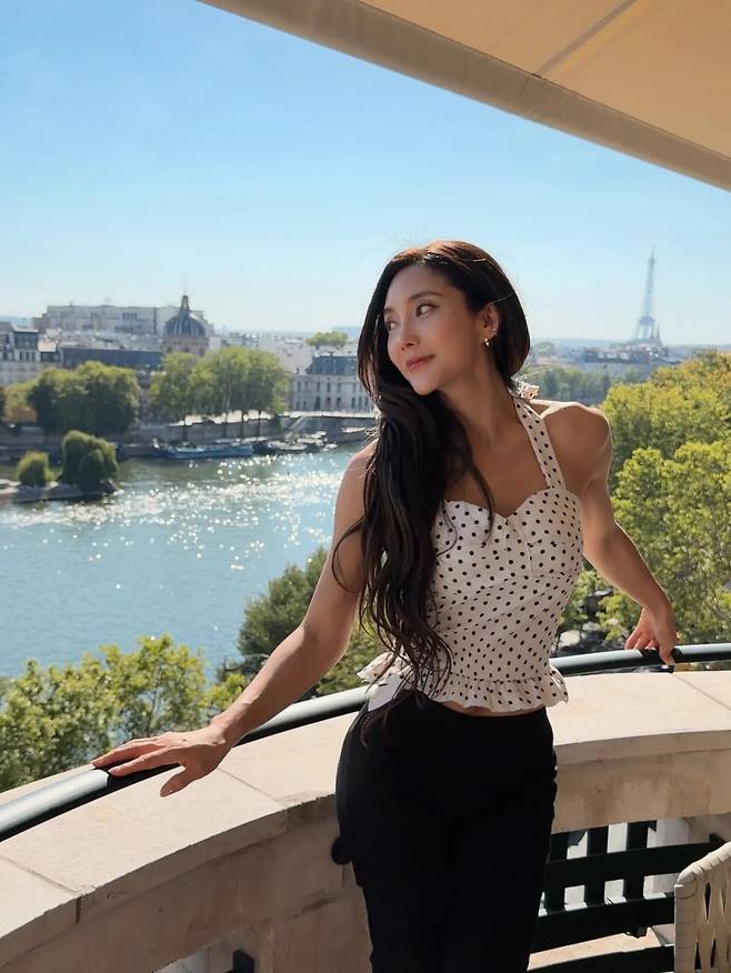 Singer Sea showed off her unchanging baby face visuals by releasing recent photos taken in Paris, France. Sharing glimpses of her daily life in Paris on her social media, Sea captivated attention with her ageless beauty and toned physique.In the released photos, Sea strikes alluring poses on a terrace overlooking the Parisian cityscape, showcasing a fashion style that exudes a strong summer vibe. In particular, her baby face, which makes it hard to believe she is 46 years old, and her lean figure drew admiration from many.Netizens who saw Seas post responded enthusiastically, praising her visuals that perfectly complemented the Parisian scenery. Sea debuted in 1997 as a member of the group S.E.S and has continued her active career to this day.