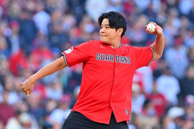 Choo Shin-Soo, former player for the Cleveland Guardians, throws the ceremonial first pitch ahead of the Guardians taking on the Tampa Bay Rays during the American League Championship Series at Progressive Field on Oct. 18. GETTY IMAGES/YONHAP