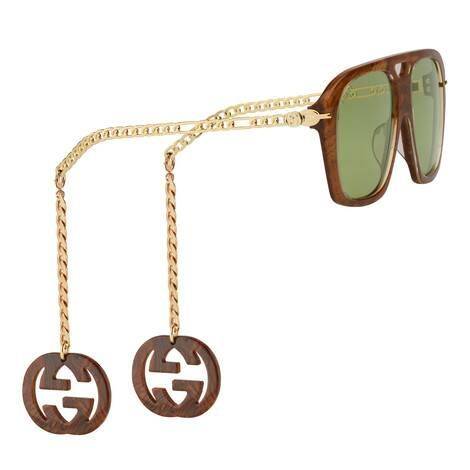 구찌의 선글라스엔 안경 다리에 탈부착이 가능한 참 장식이 달려있어 귀걸이를 따로 할 필요가 없다. 사진 구찌