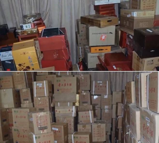 자오 씨의 빌린 집에서 발견된 뇌물들. 마오타이주만 2천900병에 달했다. (화면 출처=CCTV)