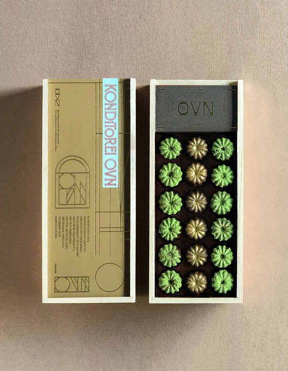 Two different flavors of canelés in a gift box available from Konditorei Oven in Hannam-dong, central Seoul. [KONDITOREI OVEN]