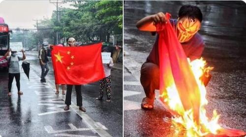 비오는 양곤 거리에서 중국의 오성홍기를 불태우는 미얀마 시위대. 2021.4.5 [SNS 캡처. 재판매 및 DB 금지]