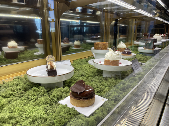 A showcase at Jardin d'Hiver offers a variety of French sweets. [LEE SUN-MIN]